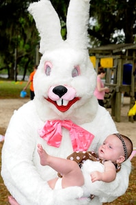 Seven-month-old Isabella Boschert bravely encounters the Easter Bunny for the first time during the annual Morale, Welfare and Recreation’s annual Eggstravaganza event held at  Marrington Plantation on Joint Base Charleston-Weapons Station April, 16. The event was held in conjunction with the Month of the Military child, providing a day filled with fun activities for the whole family of all ages. (U.S. Navy photo/Mass Communication Specialist 1st Class Jennifer Hudson)