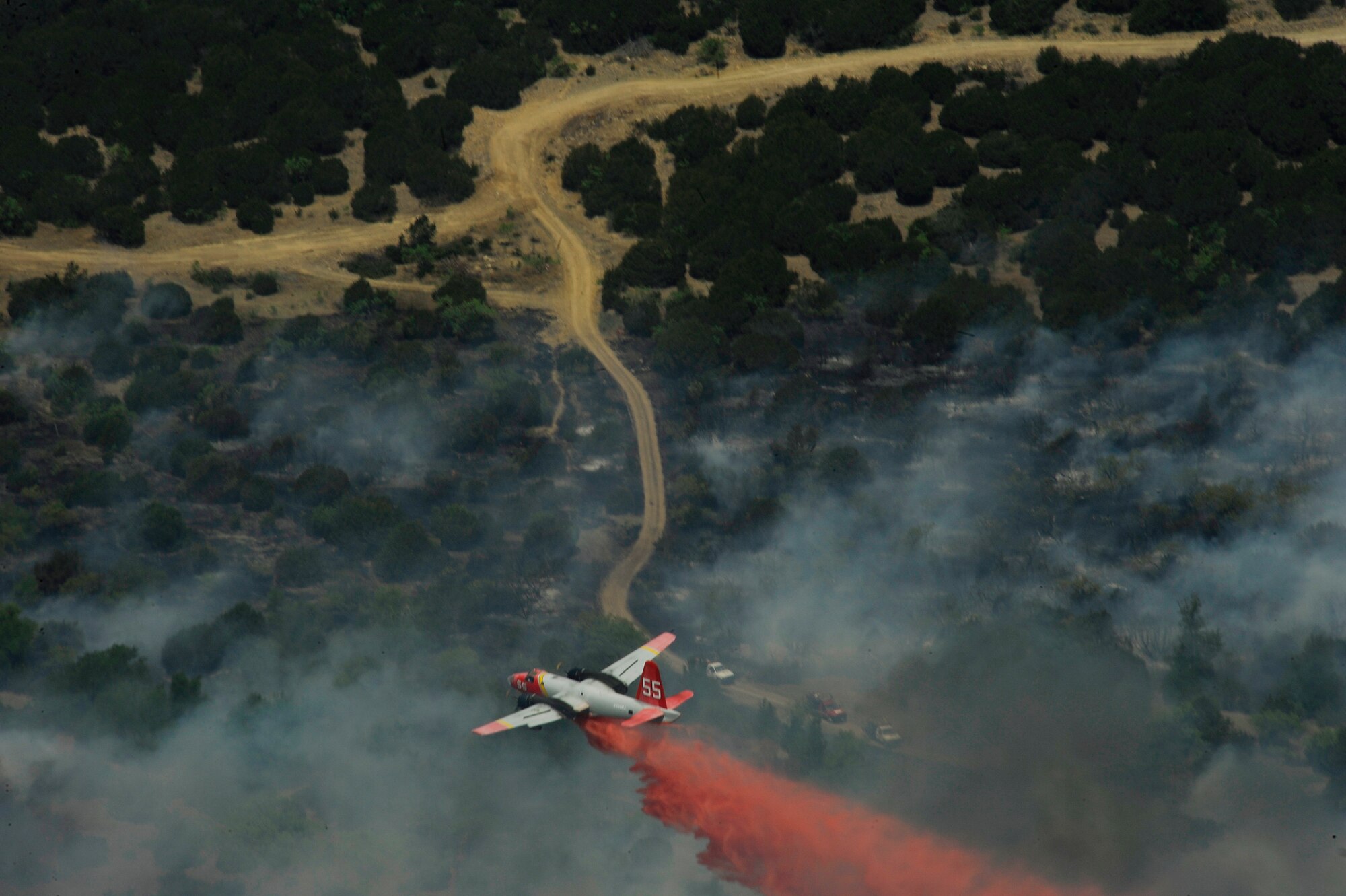 Wildfires burn in various locations across Texas, April 19, 2011.  The U.S. Forestry Service, the Air National Guard and other agencies are all fighting to put out and control these fires that have burned more than 1,000 square miles of land.  (U.S. Air Force Photo/Staff Sgt. Eric Harris)