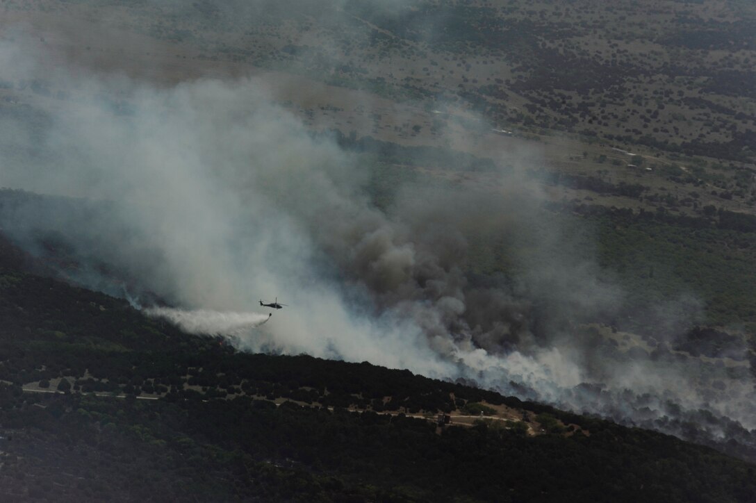 Wildfires burn in various locations across Texas, April 19, 2011.  The U.S. Forestry Service, the Air National Guard and other agencies are all fighting to put out and control these fires that have burned more than 1,000 square miles of land.  (U.S. Air Force Photo/Staff Sgt. Eric Harris)