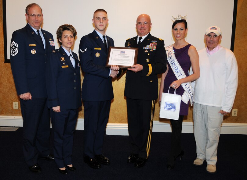 Air Force District of Washington Command Chief, Chief Master Sgt.  Pat Battenberg, 11th Operations Group Commander Col. Gina C. Humble, Airman 1st Class Benjamin Hawk, ceremonial guardsman in The U.S. Air Force Honor Guard, Maj. Gen. Karl R. Horst, commander U.S. Army Military District of Washington, Miss District of Columbia Stephanie Williams, and Chairman of USO-Metro's board Mr. John Marselle honor Airman Hawk. The Honor Guard member received an appreciation certificate from the United Service Organization, presented by Maj. Gen. Karl R. Horst, commander, U.S. Army Military District of Washington, April 16, at the officers club on Joint Base Myer-Henderson Hall, VA. Hawk was also nominated for the 2011 C. Haskell Small Award for Volunteerism. (U.S. Air Force photo by Senior Airman Christopher Ruano)