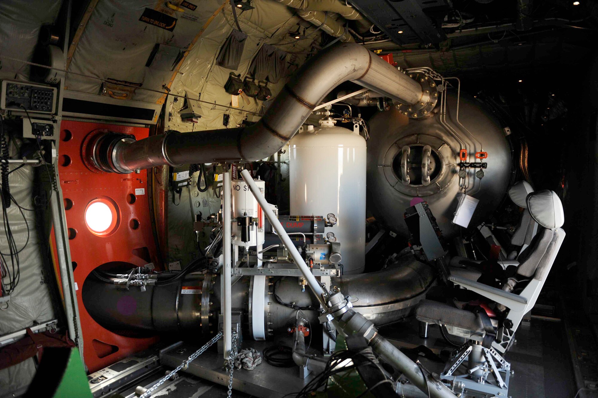 The Modular Airborne Firefighting System, like the one pictured here, is housed aboard a C-130 Hercules, and is capable of dispensing 3,000 gallons of water or fire retardant in less than 5 seconds. Airmen will use MAFFS-equipped C-130s to fight wildfires which have spread across parts of Texas and have burned more than 1,000 square miles of land. (U.S. Air Force photo/Staff Sgt. Eric Harris)