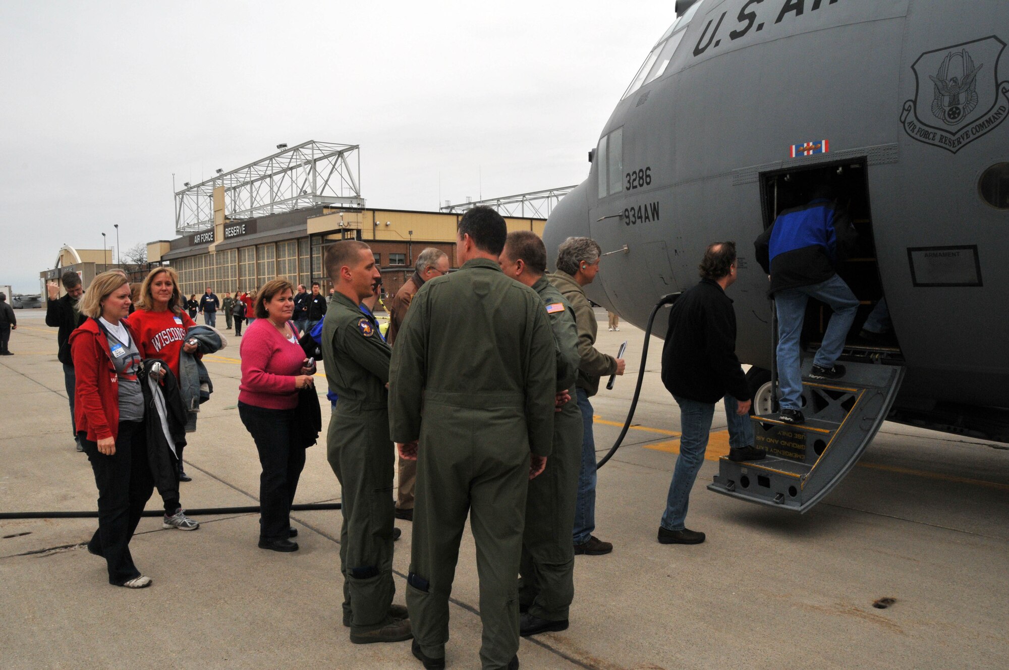 Forty educators from Minnesota and Wisconsin prepare to board their "airborne classroom" in a 934th Airlift Wing C-130 April 13.  The day also included briefings about the Air Force Reserve and 934th Airlift Wing. (Air Force Photo/Paul Zadach)
