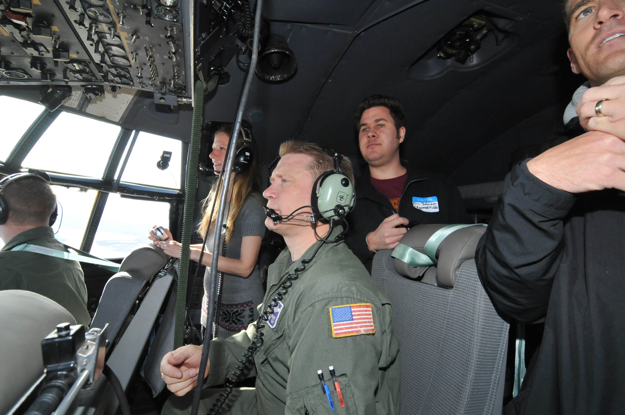 Local educators are treated to a scenic view of Lake Superior from the cockpit of a 934th Airlift Wing C-130 April 13. (Air Force Photo/Paul Zadach)