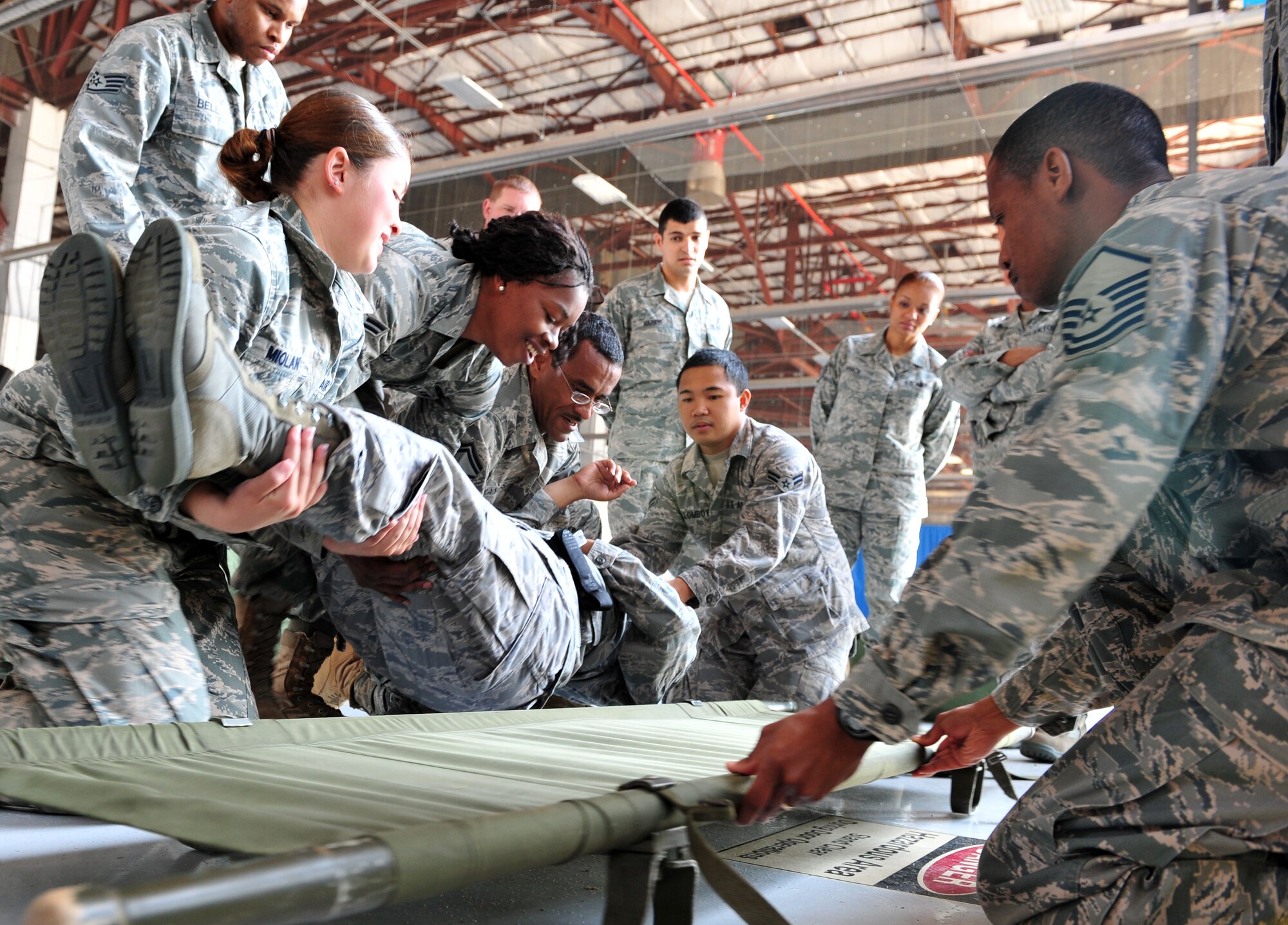 SHAW AIR FORCE BASE, S.C. - Shaw Airmen participate in the Ability to Survive and Operate Rodeo in hanger 1200 April 19, 2011. The rodeo gave Airmen the opportunity to practice hands-on war time scenarios for self-aid and buddy care, decontamination, reporting procedures and unexploded explosive ordinance identification.(U.S. Air Force photo/Airman 1st Class Tabatha L. Duarte (Released))
