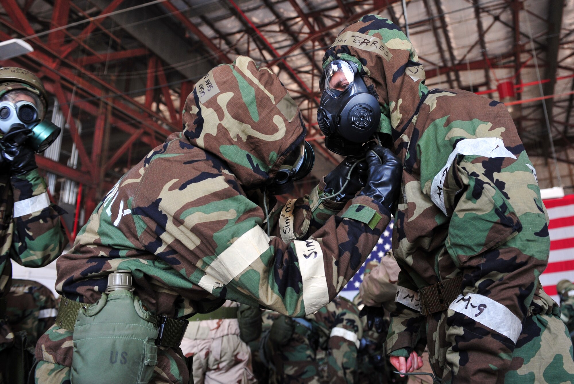 SHAW AIR FORCE BASE, S.C. - Shaw Airmen participate in the Ability to Survive and Operate Rodeo in hanger 1200 April 19, 2011. The rodeo gave Airmen the opportunity to practice hands-on war time scenarios for self-aid and buddy care, decontamination, reporting procedures and unexploded explosive ordinance identification.(U.S. Air Force photo/Airman 1st Class Tabatha L. Duarte (Released))
