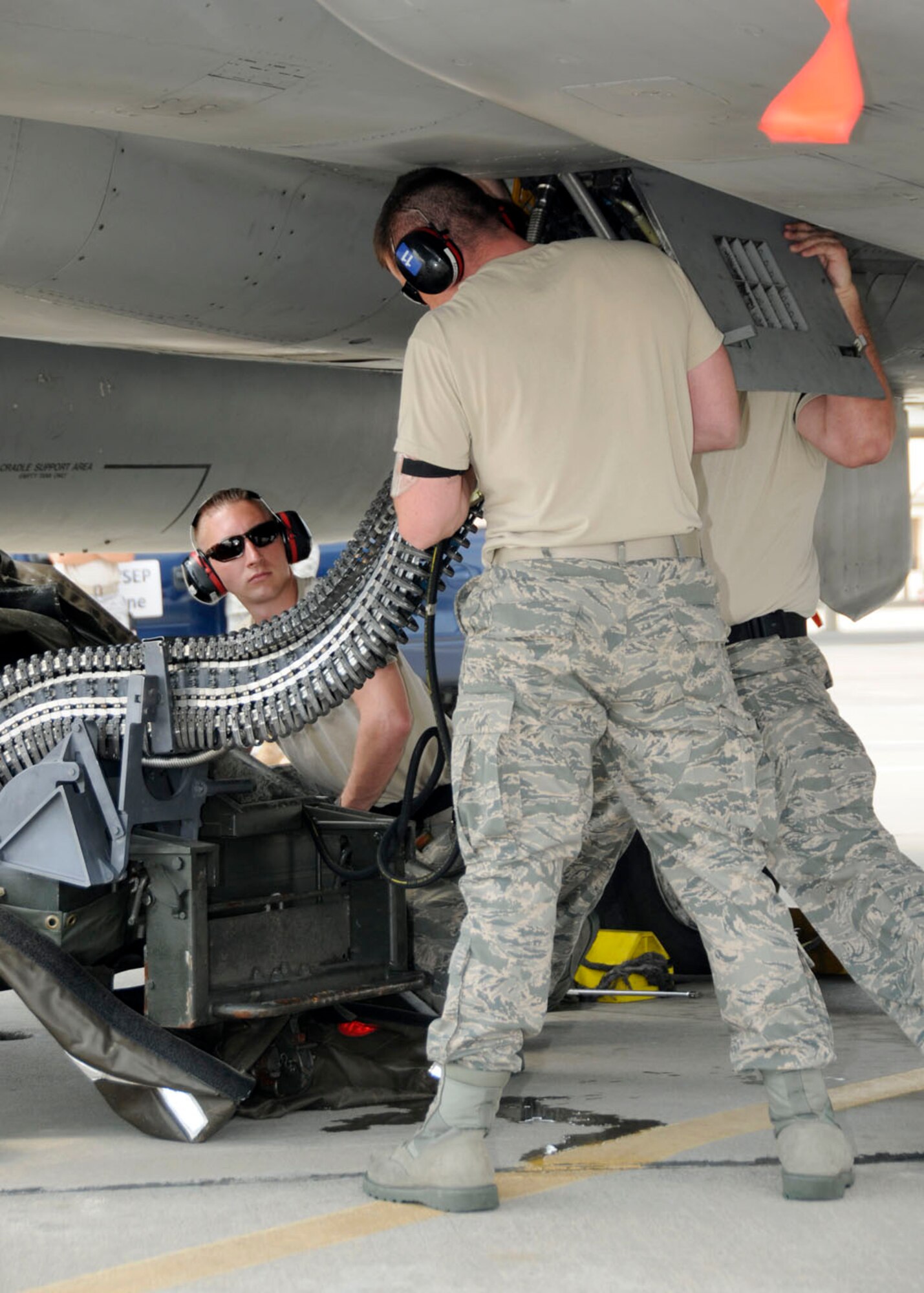 Technical Sgt. Terrance Brown, Technical Sgt. Scott Gemelli, and Staff Sgt. Ryan Quigley from the 104th Fighter Wing, Massachusetts Air National Guard unload rounds for the first time from the F-15 at Tyndall AFB, Florida as they participate in the Weapons System Evaluation Program (WSEP), known as Combat Archer, on April 19, 2011. This training is important for the ground crews to test their maintenance systems and processes while loading live munitions on the F-15 eagle, as well as critical live war fighting training for the F-15 pilots to employ air-to-air missiles against real world targets.  (U.S.A.F. photograph by Senior Master Sgt. Robert J. Sabonis)