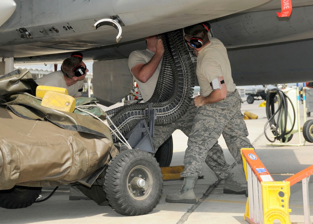 Technical Sgt. Terrance Brown, Technical Sgt. Scott Gemelli, and Staff Sgt. Ryan Quigley from the 104th Fighter Wing, Massachusetts Air National Guard unload rounds for the first time from the F-15 at Tyndall AFB, Florida as they participate in the Weapons System Evaluation Program (WSEP), known as Combat Archer, on April 19, 2011. This training is important for the ground crews to test their maintenance systems and processes while loading live munitions on the F-15 eagle, as well as critical live war fighting training for the F-15 pilots to employ air-to-air missiles against real world targets.  (U.S.A.F. photograph by Senior Master Sgt. Robert J. Sabonis)