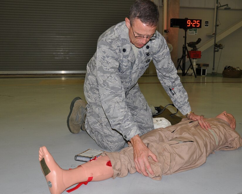 Lt Col Kevin Riley, 315th Mission Support Group, performs self aid and buddy care on a dummy over the UTA weekend. With the clock winding down, reservists from the 315th had to diagnose and treate injuries under the watchful eyes of evaluators. (U.S. Air Force Photo/2nd Lt Jeff Kelly)