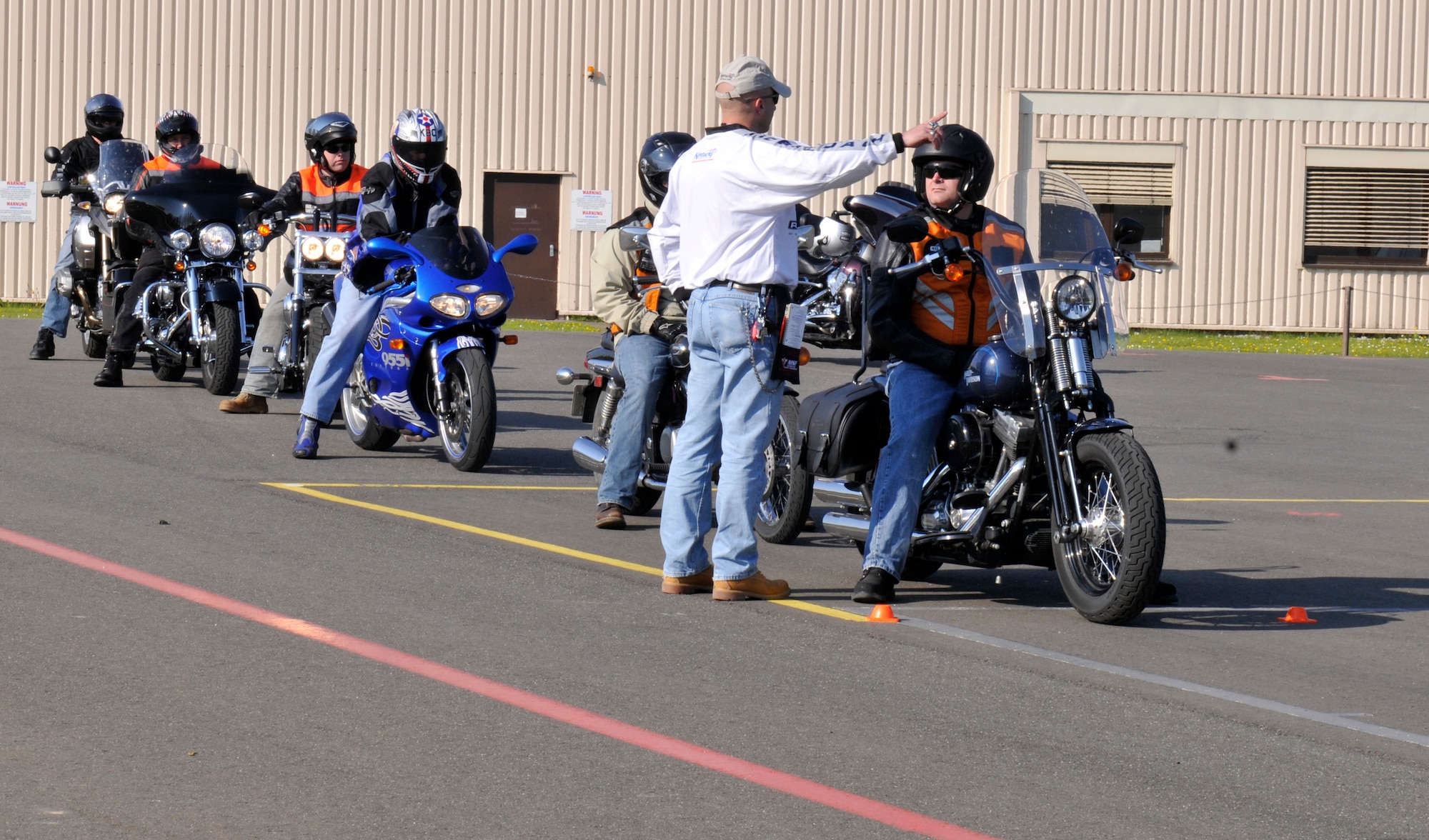 SPANGDAHLEM AIR BASE, Germany – Master Sgt. Donald Tresler, 76th Airlift Squadron Ramstein Air Base, Germany, instructs riders during a rider-coach preparation workshop here April 19 hosted by the 52nd Fighter Wing Safety Office. The workshop consists of a nine-day class where motorcyclists learn how to become an instructor and teach the basic motorcycle safety course to beginners. Service members and U.S. civilians are required to take the basic motorcycle safety course before riding a motorcycle on or off base and its free. (U.S. Air Force photo/Airman 1st Class Brittney Frees)