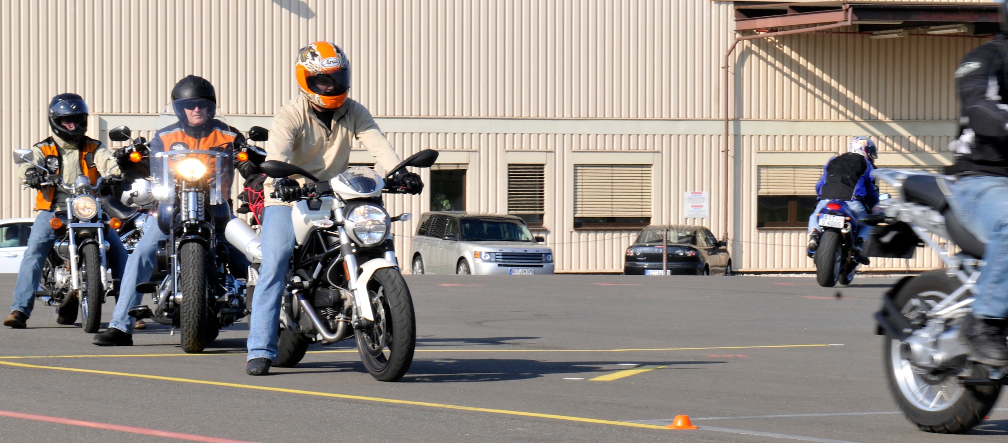 SPANGDAHLEM AIR BASE, Germany – Airmen wait to ride their motorcycles during a rider-coach preparation workshop here April 19 hosted by 52nd Fighter Wing Safety Office. The workshop consists of a nine-day class where motorcyclists learn how to become an instructor and teach the basic motorcycle safety course to beginners. Service members and U.S. civilians are required to take the basic motorcycle safety course before riding a motorcycle on or off base and its free. (U.S. Air Force photo/Airman 1st Class Brittney Frees)