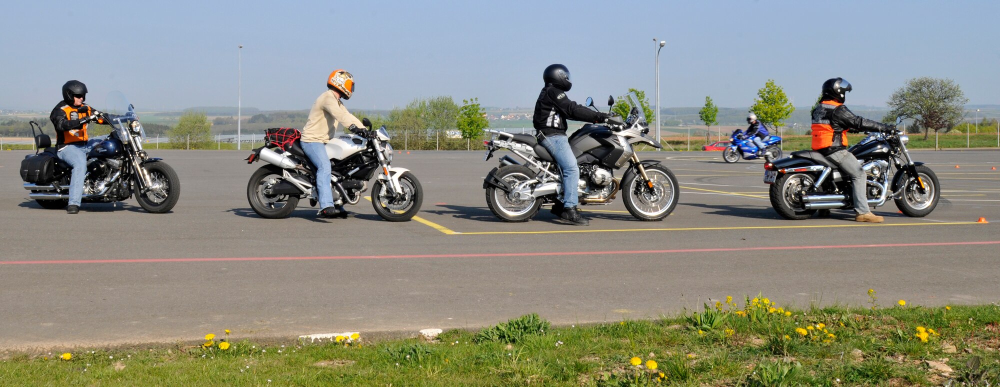 SPANGDAHLEM AIR BASE, Germany – Airmen wait to ride their motorcycles during a rider-coach preparation workshop here April 19 hosted by the 52nd Fighter Wing Safety Office. The workshop consists of a nine-day class where motorcyclists learn how to become an instructor and teach the basic motorcycle safety course to beginners. Service members and U.S. civilians are required to take the basic motorcycle safety course before riding a motorcycle on or off base and its free. (U.S. Air Force photo/Airman 1st Class Brittney Frees)