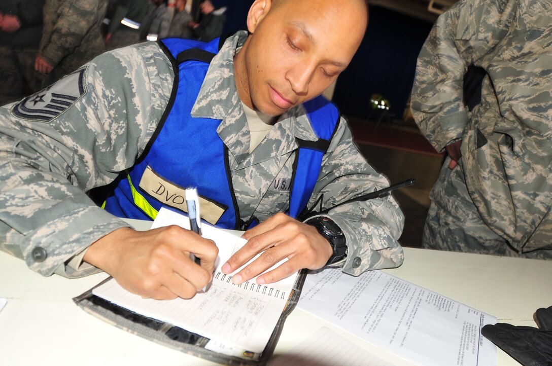 U.S. Air Force Master Sgt. Marquis L. Travis, Vehicle Operations Superintendant for the 35th Logistics Readiness Squadron from Misawa AB, and a Memphis, Tenn.-native, completed the manifest for a convoy to Ofunato, Japan that included 240 passengers from search and rescue teams, 60 tons of cargo, seven trucks, four busses, and nine pickup trucks as part of the disaster relief that was flown in here to support Operation Tomodachi March 13, 2011.