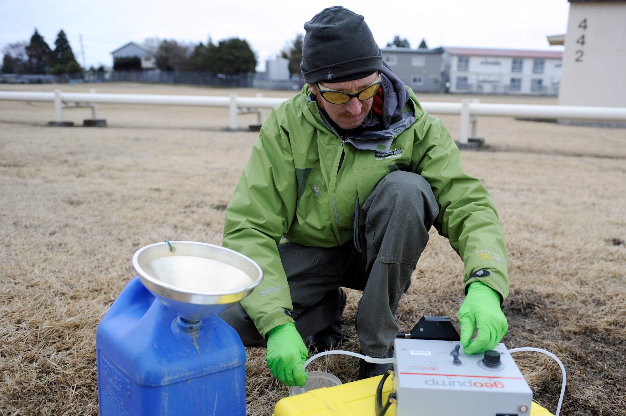 MISAWA AIR BASE, Japan -- Nathan Williams, contractor, uses a geopump to take a sample of ground 
water on 20 April. Geopumps are designed for single and multi-stage pressure or vacuum pumping of 
liquids and is ideally suited for field sample removal from shallow wells. (U.S. Air Force photo by Staff 
Sgt. Marie Brown\Released)
