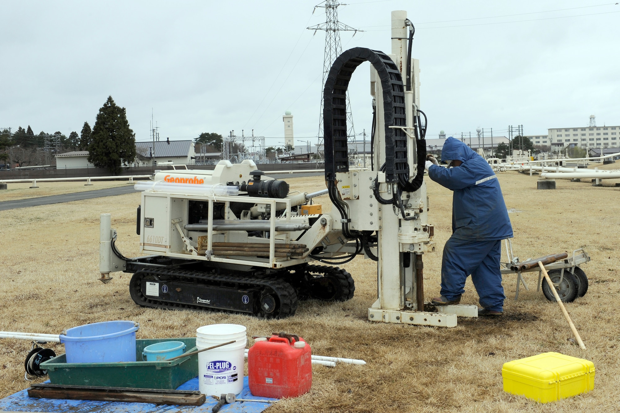 MISAWA AIR BASE, Japan -- A Japanese subcontractor uses an auger to drill into the ground 20 April. The auger is a direct push drilling system equipped with 21 tons of pulling capacity for larger sampling tools and deeper depths. (U.S. Air Force photo by Staff Sgt. Marie Brown\Released)
