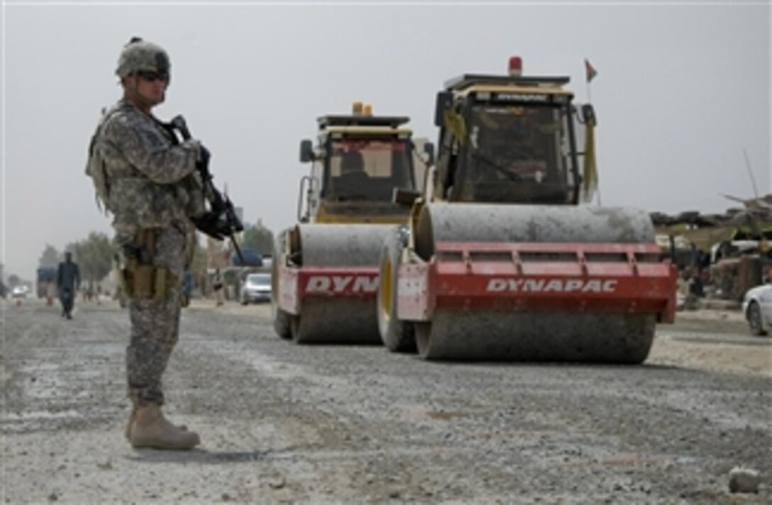 U.S. Army Sgt. Randy Elmore, a team leader with Zombie Response Team, 525th Battlefield Surveillance Brigade, guards a reconstruction project along Highway 4 in Spin Boldak, Afghanistan, on April 8, 2011.  The construction was part of a reconstruction project funded by a commander's emergency response program that included repairs to 7.8 kilometers of road from the Pakistan border into Afghanistan.  