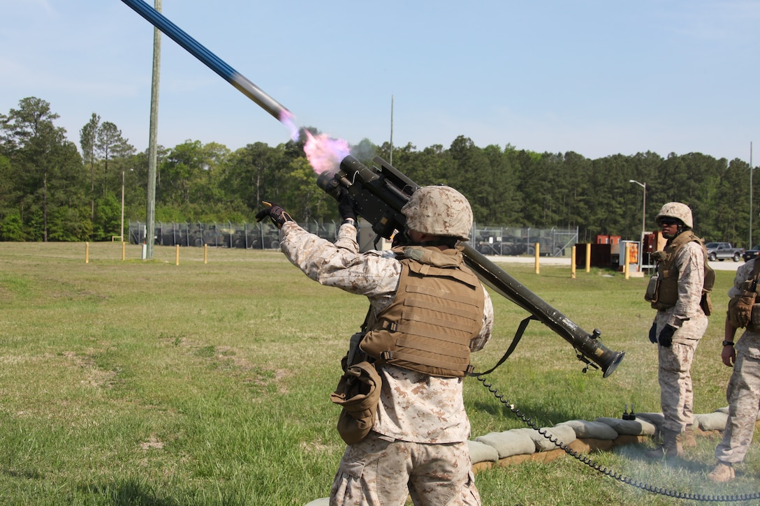 Fire erupts out of the tail of a dummy round as gunners with Battery A, 2nd Low Altitude Air Defense Battalion fire the Stinger missile during the battery’s Stinger launch simulator training April 21. The dummy round is a 25-pound aluminum tube that flies between 85-100 yards.