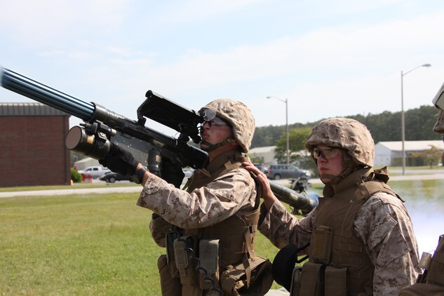 Lance Cpl. Joseph S. Spindle and Lance Cpl. Richard J. Eddy, both gunners with Battery A, 2nd Low Altitude Air Defense Battalion, fire a Stinger Missile dummy during the battery’s Stinger launch simulator training April 21. “This was my first time firing the simulator and it definitely gives you the real life simulation of a live Stinger Missile,” said Spindle. “It gives you a feel of a live missile’s kick and it was great getting a chance to freshen up our tactical skills.”