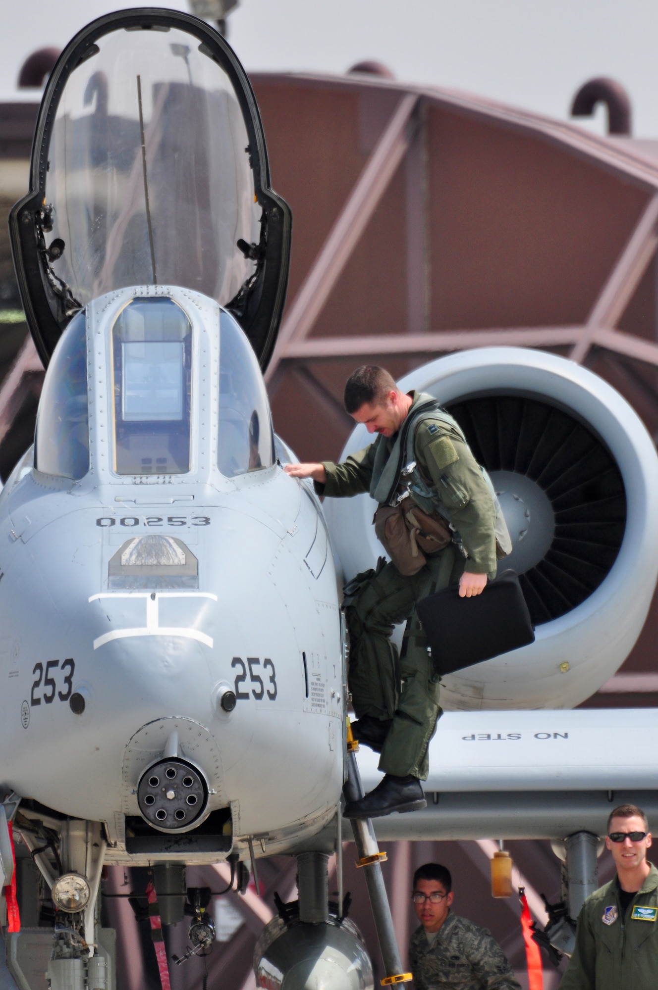 Capt. Dan Haugh, 25th Fighter Squadron, climbs out of the cockpit of an A-10 Thunderbolt II April 21.The last two A-10C Thunderbolt II aircraft return to the Korean Peninsula from Exercise COPE TIGER/Balikatan deployment, which marks the first time that all A-10C model aircraft assigned to Osan AB ROK have been on the Korean Peninsula at the same time. The A-10C's primary mission is to provide lethal, precision firepower in any potential close air support scenario. (U.S. Air Force photo/Staff Sgt. Chad Thompson)