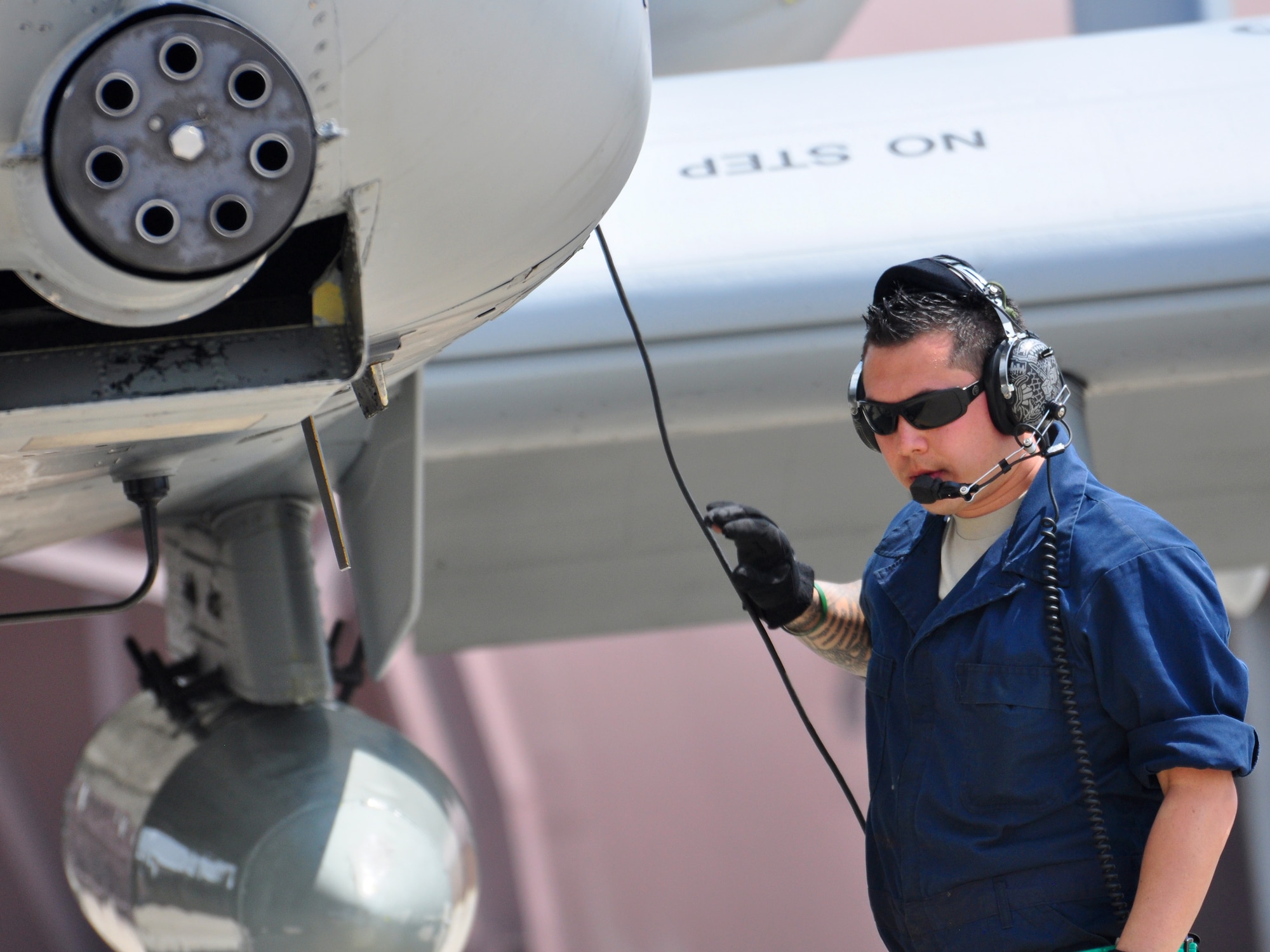 Senior Airman Stephen Yelland, 51st Aircraft Maintenance Squadron, talks to a pilot on a headset while receiving an aircraft April 21.The last two A-10C Thunderbolt II aircraft return to the Korean Peninsula from Exercise COPE TIGER/Balikatan deployment, which marks the first time that all A-10C model aircraft assigned to Osan AB ROK have been on the Korean Peninsula at the same time. The A-10C's primary mission is to provide lethal, precision firepower in any potential close air support scenario. (U.S. Air Force photo/Staff Sgt. Chad Thompson)