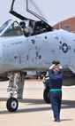 Staff Sgt. Christopher Hensley, 51st Aircraft Maintenance Squadron, marshals an A-10 Thunderbolt II into the Draggins Lair April 21. The last two A-10C Thunderbolt II aircraft return to the Korean Peninsula from Exercise COPE TIGER/Balikatan deployment, which marks the first time that all A-10C model aircraft assigned to Osan AB ROK have been on the Korean Peninsula at the same time. The A-10C's primary mission is to provide lethal, precision firepower in any potential close air support scenario. (U.S. Air Force photo/Staff Sgt. Chad Thompson)