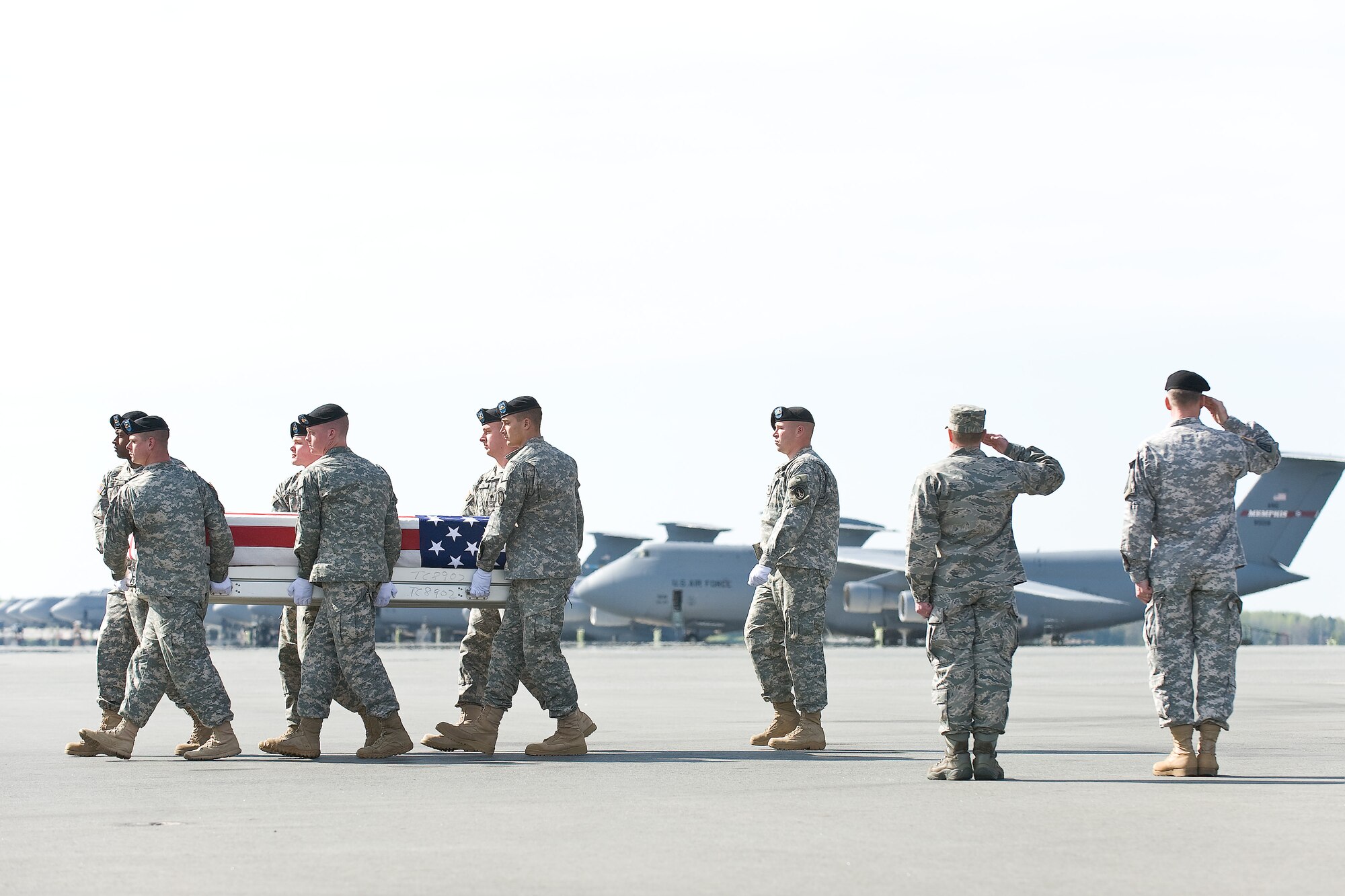 A U.S. Army carry team transfers the remains of Army Pfc. John F. Kihm, of Philadelphia, Pa., at Dover Air Force Base, Del., April 21, 2011. Kihm was assigned to the 1st Battalion, 32nd Infantry Regiment, 3rd Brigade Combat Team, 10th Mountain Division, Fort Drum, N.Y. (U.S. Air Force photo/Roland Balik)