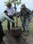 LAUGHLIN AIR FORCE BASE, Texas – Col. Angela Cadwell, 47th Mission Support Group commander, Dan Gallegos and Steve Barnes, both of the 47th Civil Engineering Squadron, plant a tree at an Arbor Day ceremony at Laughlin’s Leaning Pines Golf Course April 21. Jack Johnson, a ranger with the National Park Service, spoke at the ceremony and Colonel Cadwell signed a proclamation declaring Laughlin’s recognition of Arbor Day. (U.S. Air Force photo by Airman 1st Class Blake Mize) 