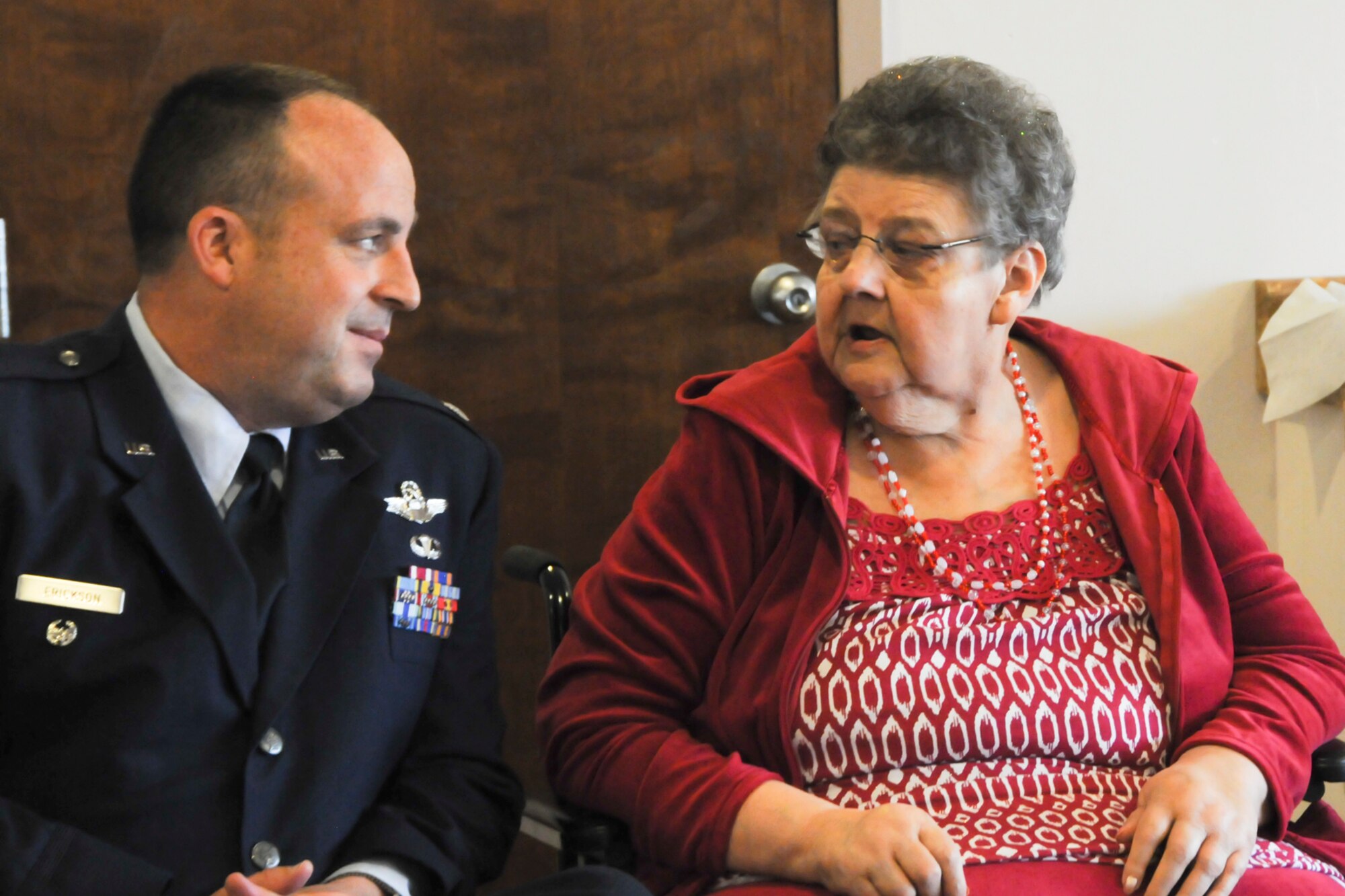 Lt. Col. Robert Erickson, State Director of Air Operations, talks with Mrs. Joannie Hollenbeek, one of the Rose Queen canidates, before the ceremony.  Members of the Oregon Air National Guard volunteered to help with the 2011 Rose Queen Corenation ceremony at Plum Ridge Marquis Care in Klamath Falls, Ore. April 8, 2011. (U.S. Air Force Photo by Tech.Sgt. Jennifer Shirar, RELEASED)
