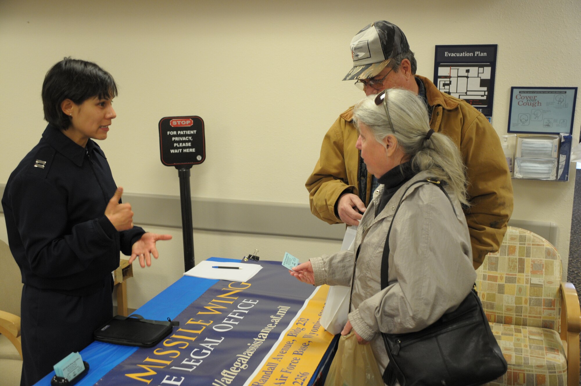 Capt. Star Lopez, 90th Missile Wing Legal Office, discusses benefits and legal services  offered at the legal office with retired military members at the 90th Medical Group Saturday during Warren's Military Retiree Appreciation Day Saturday. (U.S. Air Force photo by Blaze Lipowski)