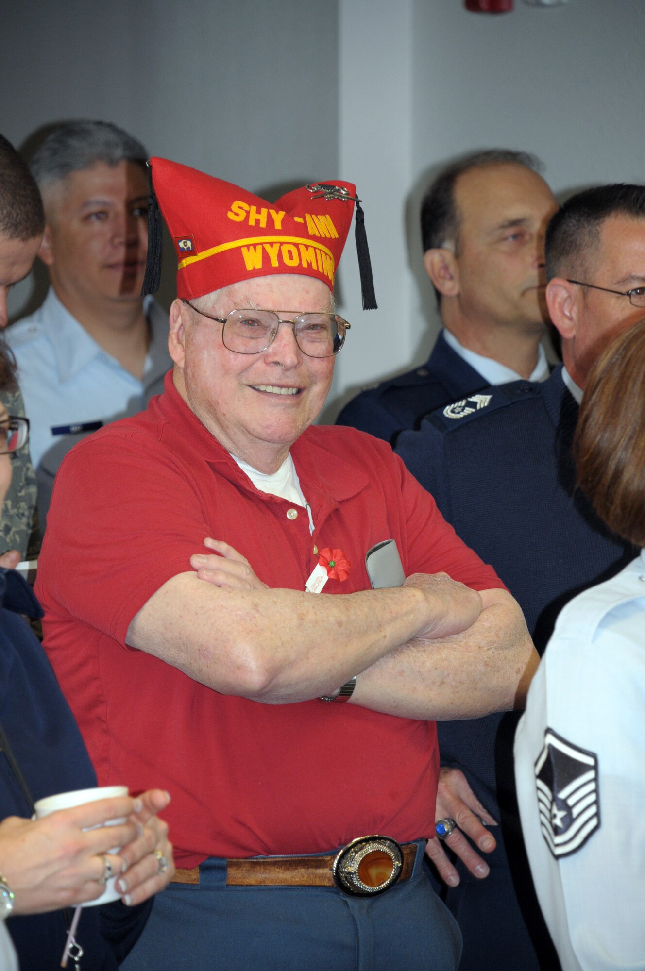 A member of Cheyenne's Veterans of Foreign Wars Post 1881 listens as Col. Scott Fox, 90th Missile Wing vice commander, welcomes local retired military members to the 90th Medical Group for Warren's Military Retiree Appreciation Day here Saturday. (U.S. Air Force photo by Blaze Lipowski)