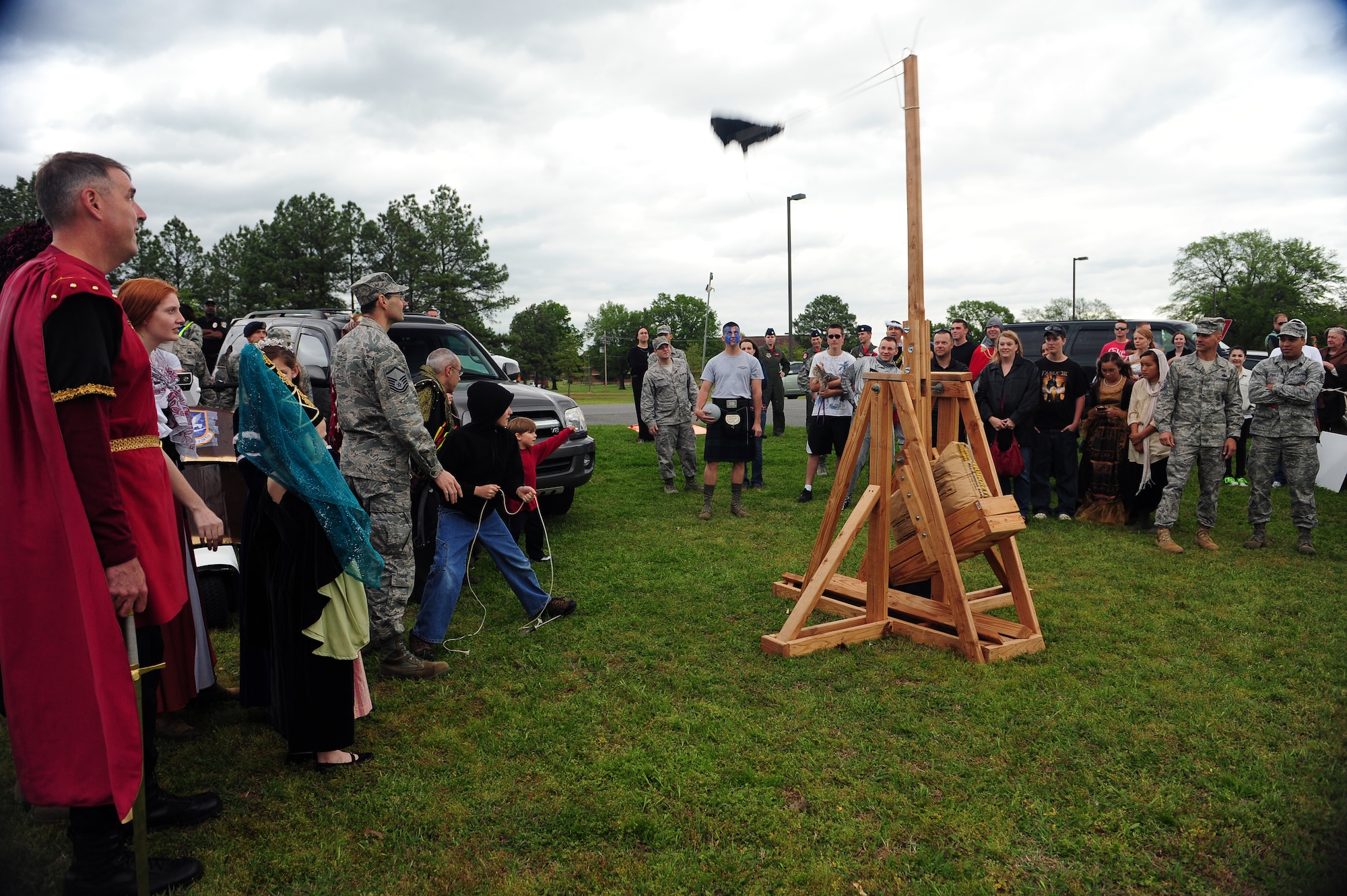 Members of the 19th Airlift Wing compete in a catapult building competition during the Medieval Knight event April 15, 2011, at Little Rock Air Force Base, Ark. The winning group took home the Excalibur trophy and bragging rights for one year. (U.S. Air Force photo by Staff Sgt. Chris Willis)