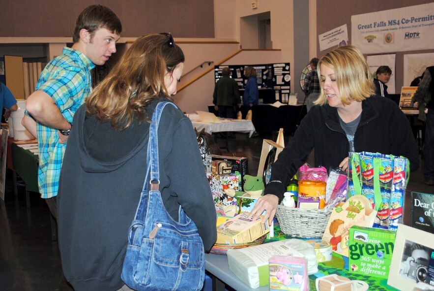 Janelle Broach (right), a Malmstrom family member, explains the benefits of using environmentally friendly household products to members of the community attending the Earth Day celebration.  Ms. Broach displayed several 'green' alternatives to every day products.  (U.S. Air Force photo/Airman Cortney Hansen)