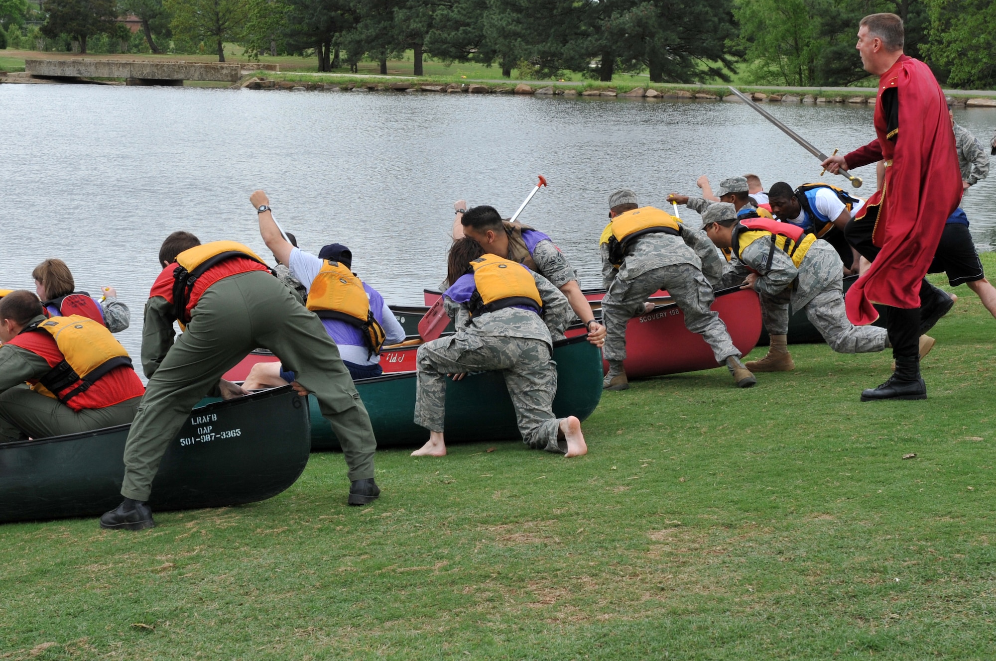 Members of Team Little Rock participate in the moat crossing competition during the Medieval Knight event April 15, 2011, at Little Rock Air Force Base, Ark. Medieval Knight was open to all members of Team Little Rock and their families to enjoy different events such as jousting, moat crossing, and catapulting. (U.S. Air Force photo by Airman 1st Class Rusty Frank)