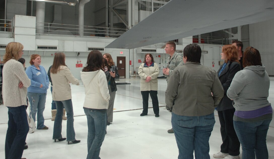 Col. James Katrenak, 28th Maintenance Group commander, guides Air Force spouses on a private tour of a B-1B Lancer during the Heart Link program at Ellsworth Air Force Base, S.D., April 18, 2011.  The spouses learned about the aircraft’s capabilities, and had the opportunity to view the cockpit.  (U.S. Air Force photo by Airman 1st Class Alessandra N. Gamboa)