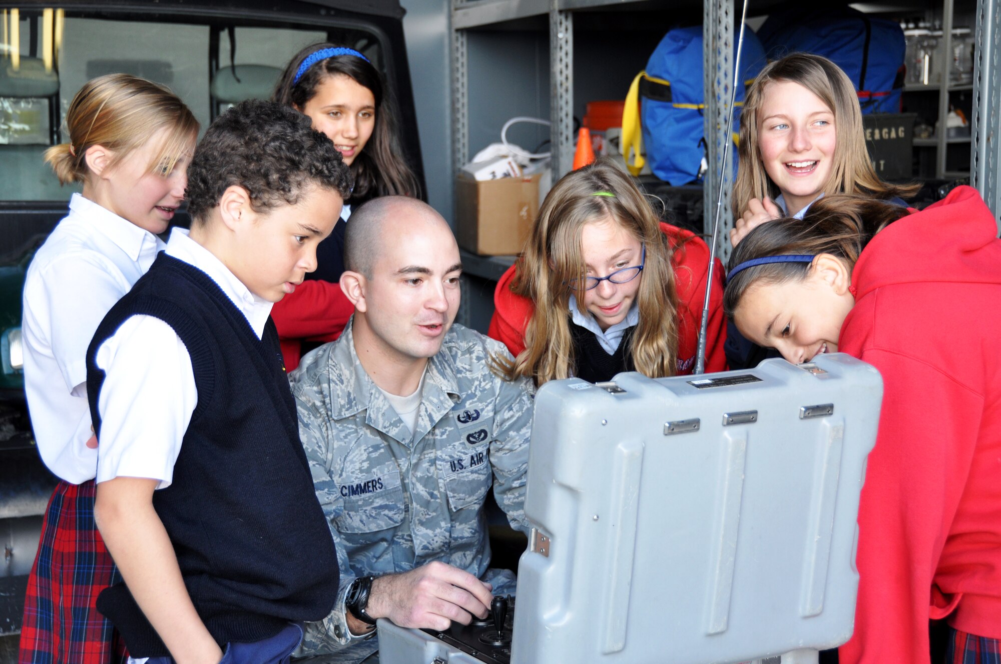 Senior Airman John Cimmers, 419th Explosive Ordnance Disposal, shows the students of Blessed Sacrament Catholic School how to maneuver the EOD robot, which is used to detonate explosives remotely. (U.S. Air Force photo/Bryan Magaña)  