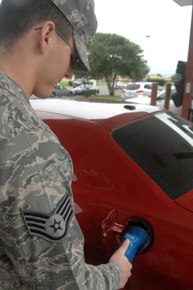 Staff Sgt. Marcus O'Sullivan, 2nd Operations Group NCO in-charge of intelligence operations support, fuels up his vehicle at the Barksdale Shoppette. The Army Air Force Exchange Service surveys five local locations and sets their gasoline prices to the lowest price surveyed for each grade. (U.S. Air Force photo/Senior Airman Allison M. Boehm)(RELEASED)