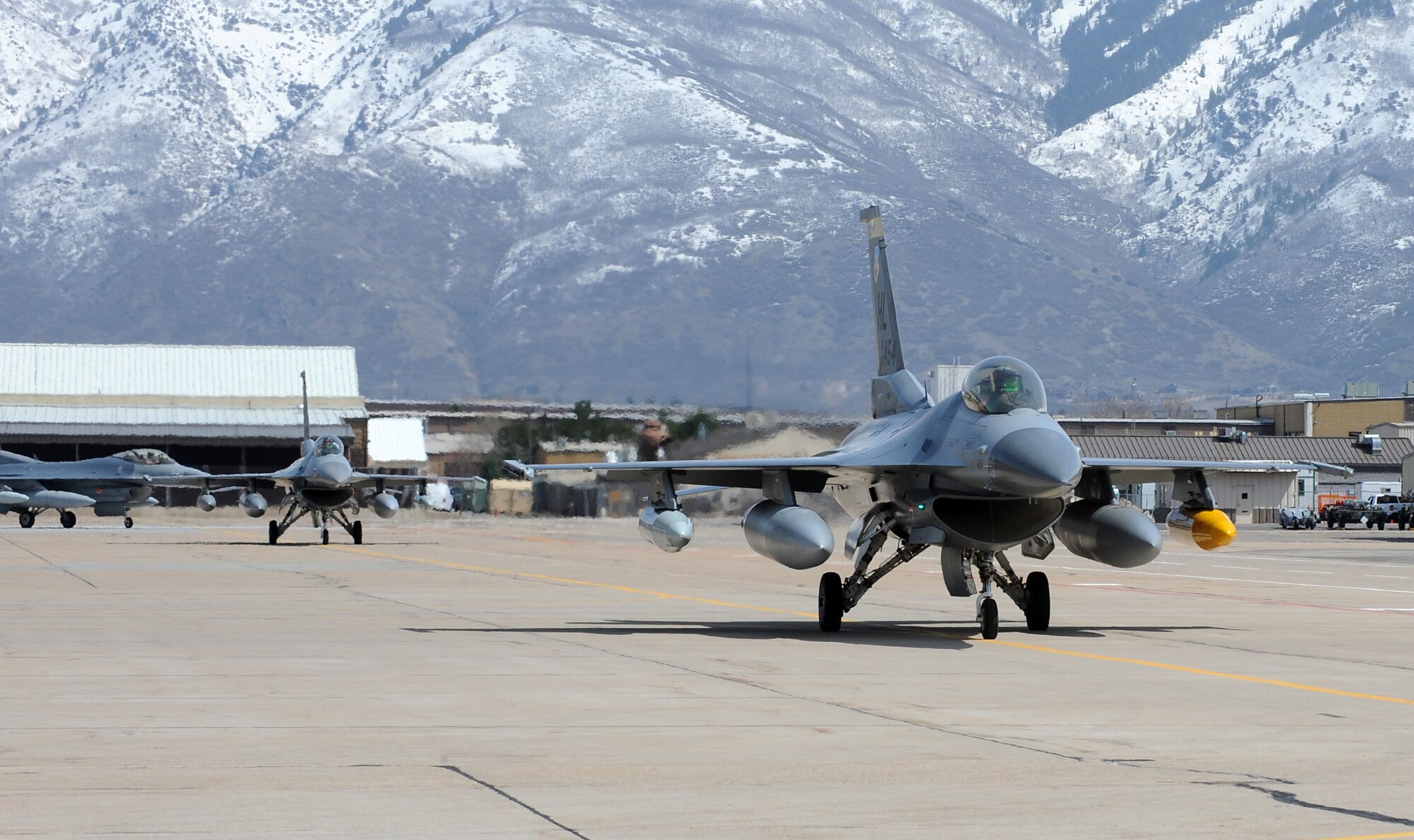 Lt. Col. William Bailey, 4th Fighter Squadron commander, leads a flight of six F-16s to their final parking slots after a long return flight from Afghanistan. (U.S. Air Force photo by Alex Lloyd)