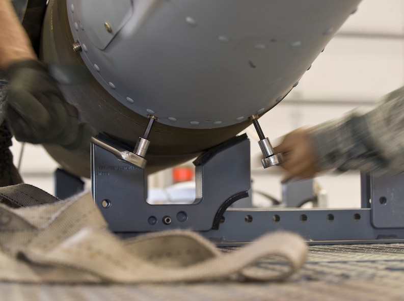 Airmen from the 2nd Munitions Squadron disassemble a Joint Direct Attack Munition GBU-31 in the munitions storage area on Barksdale Air Force Base, La., April 20. The JDAMs are built to support the B-52H Stratofortress mission, and if not used are disassembled for storage. (U.S. Air Force photo/Senior Airman Chad Warren)(RELEASED)