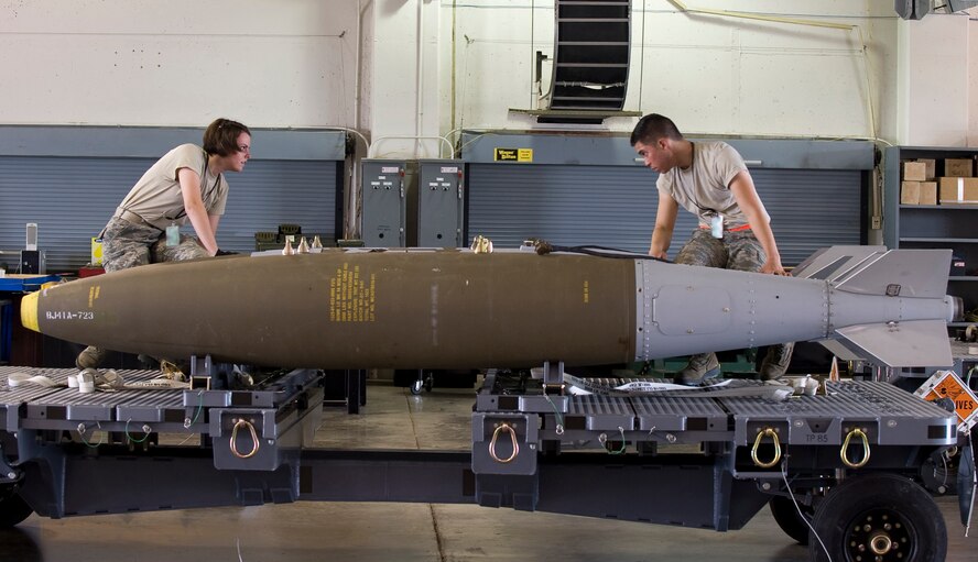 Airman 1st Class Katelynn Baker and Airman 1st Class Niko Bryson, 2nd Munitions Squadron, disassemble a Joint Direct Attack Munition GBU-31 in the munitions storage area on Barksdale Air Force Base, La., April 20. The JDAMs are built to support the B-52H Stratofortress mission, and if not used are disassembled for storage. (U.S. Air Force photo/Senior Airman Chad Warren)(RELEASED)