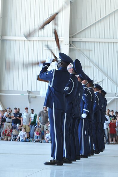 SEYMOUR JOHNSON AIR FORCE BASE, N.C. -- Airmen from the U.S. Air Force Honor Guard Drill Team perform during the Wings Over Wayne Air Show and Open House here, April 17, 2011. The honor guard's line sequence is a trademark maneuver performed in every performance. (U.S. Air Force photo/Senior Airman Whitney Lambert) (RELEASED)
