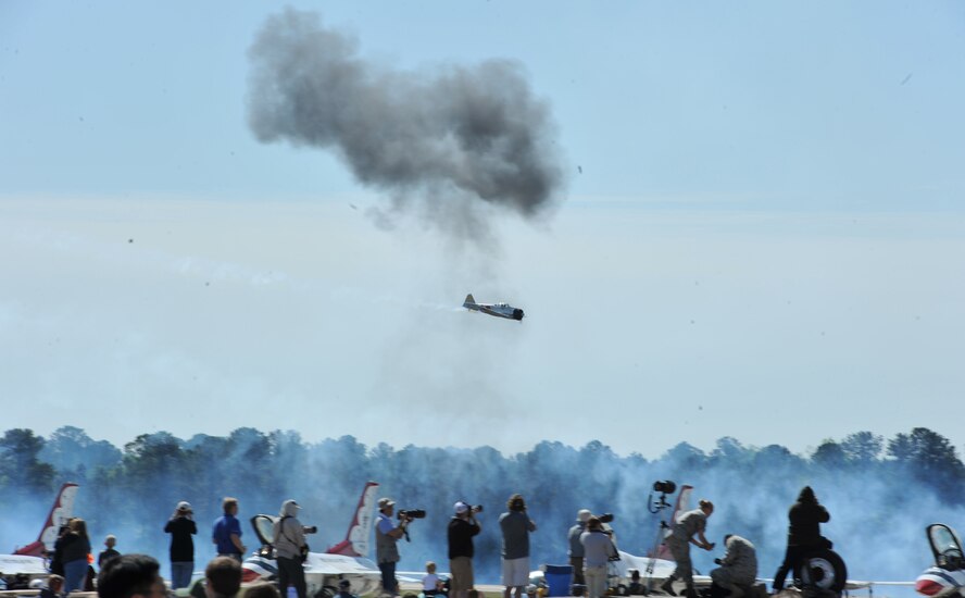SEYMOUR JOHNSON AIR FORCE BASE, N.C. -- Media personnel document the Tora! Tora! Tora! performance during the Wings Over Wayne Air Show and Open House here, April 17, 2011. Tora! Tora! Tora! participates in 12 to 16 events a year recreating the Japanese attack on Pearl Harbor that began America's involvement in World War II.  (U.S. Air Force photo/Senior Airman Whitney Lambert) (RELEASED)