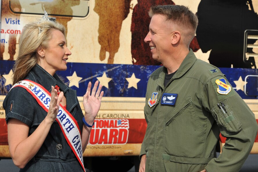 SEYMOUR JOHNSON AIR FORCE BASE, N.C. -- Mrs. North Carolina, Dawn Brinkley, speaks with Col. Patrick Doherty, 4th Fighter Wing commander, during the Wings Over Wayne Air Show and Open House here, April 17, 2011. Mrs. Brinkley is the spouse of a U.S. Marine and the director of the Veteran's Outreach for the American Dystonia Society. (U.S. Air Force photo/Senior Airman Whitney Lambert) (RELEASED)