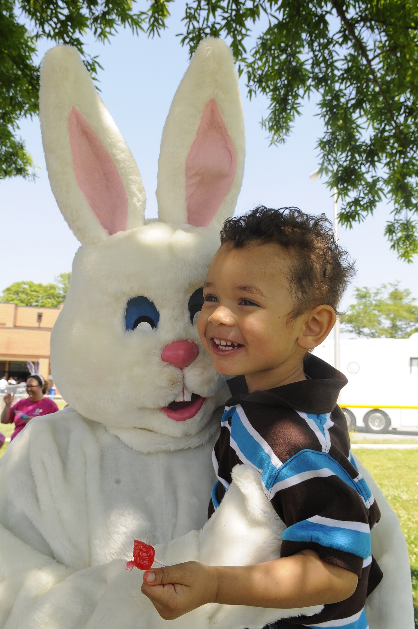 Jayden Emerson, 2, gets a hug from the Easter Bunny at the Family Fest event at Robins Youth Center April 16. Jayden is the son of TSgt. Leigh Ann Emerson. The event was a celebration of April being the month of the military child, child abuse awareness and volunteerism. U. S. Air Force photo by Sue Sapp