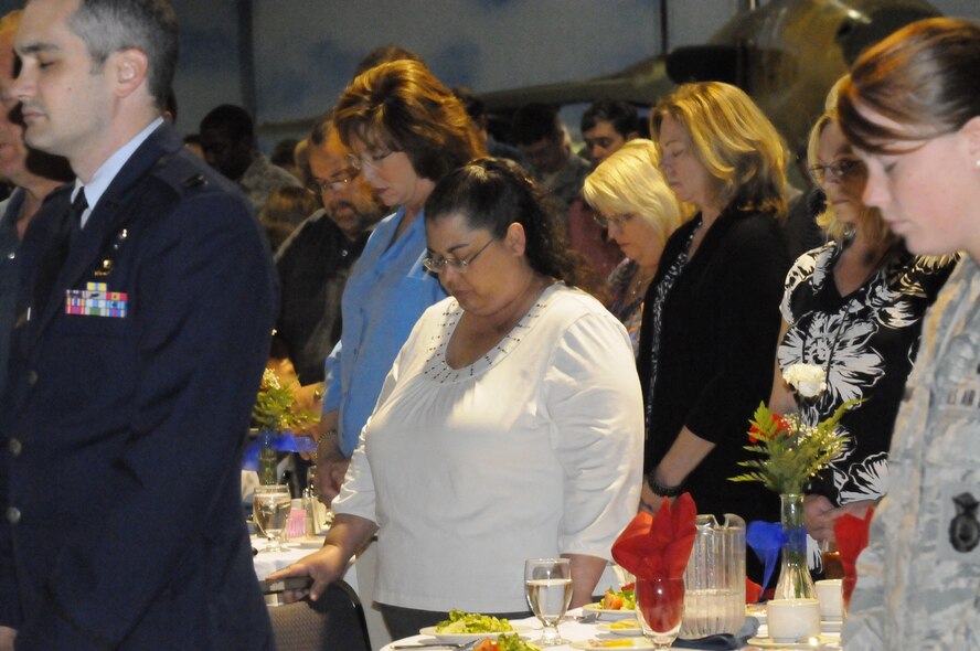 Attendees at the Robins National Prayer Luncheon bow their heads in prayer. The guest speker for the event was Dan Reeves, former Atlanta Falcons and Denver Broncos head coach. U. S. Air Force photo by Sue Sapp