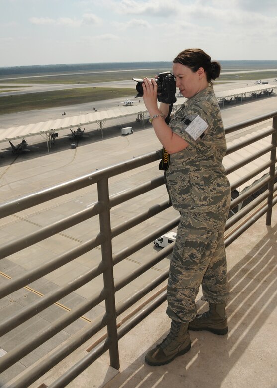 Tech. Sgt. Melanie Casineau, 104FW/Public Affairs office, takes a photo of the Mass. Air National Guard F-15C Eagles on the ramp at Tyndall Air Force Base Fla. while they participate in Exercise Combat Archer, part of the Weapon System Evaluation Program. 
