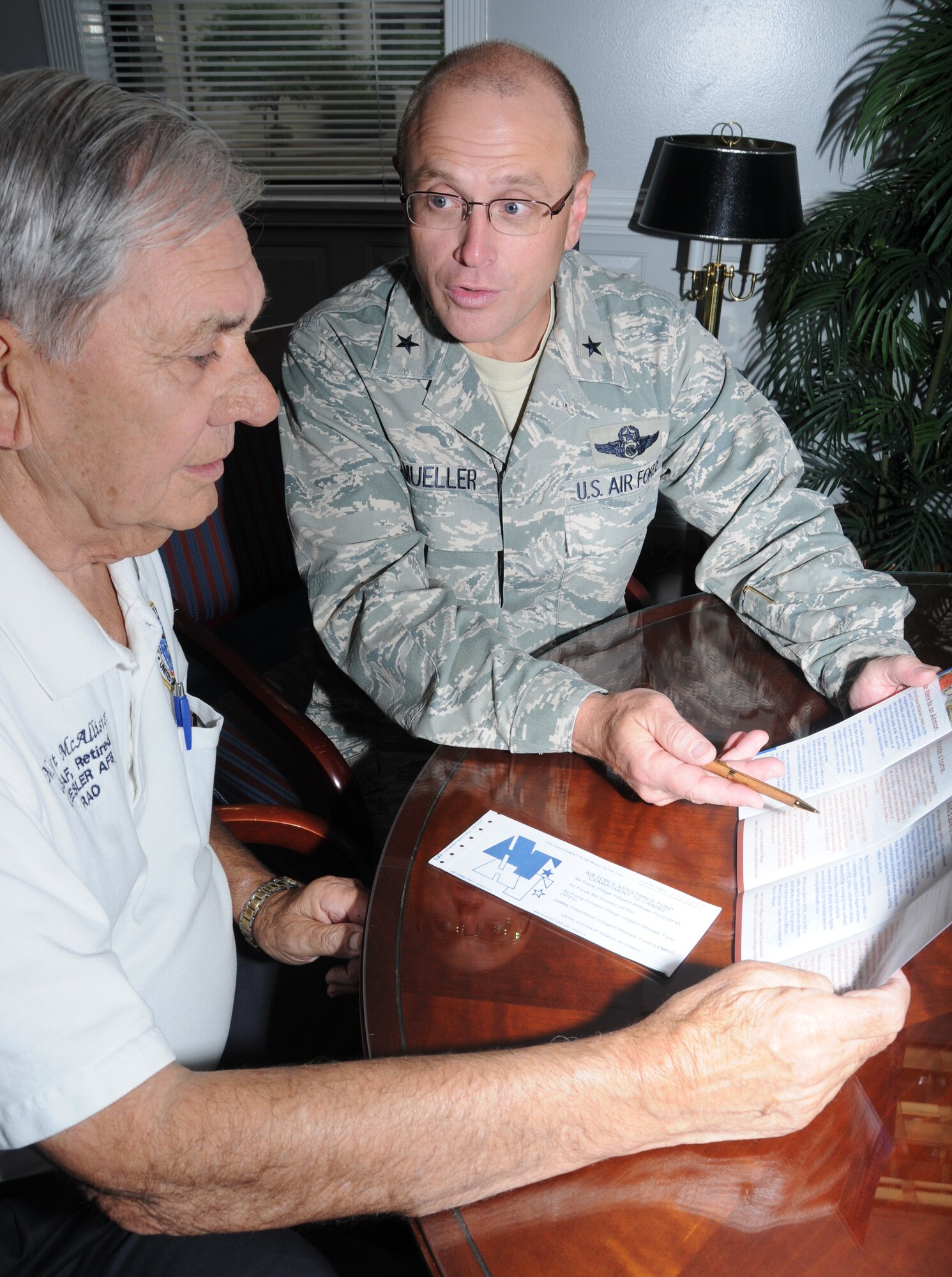 Ivan McAllister, director of the Keesler Retiree Activities Office, talks about the AFAF campaign with Brig Gen. Andrew Mueller, 81st Training Wing commander, Friday. Retirees are able to make cash donations or authorize payroll deductions to AFAF.  (U.S. Air Force photo by Kemberly Groue)