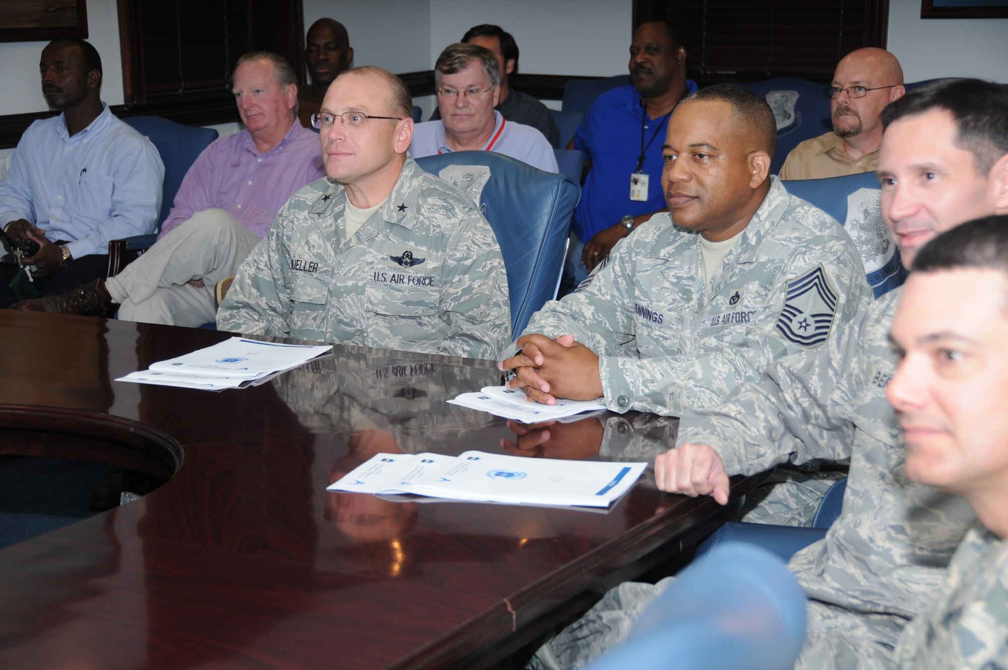 At table from left, Brig. Gen. Andrew Mueller, 81st TrainingWing commander; Chief Master Sgt. Curtis Jennings, 81st TRW command chief; Col. Rodney Berk, 81st Mission Support Group commander, and Lt. Col. Sean Gallagher, 81st MSG deputy commander, and other base personnel listen as Lt. Col. James Humes gives a briefing on Air Education and Training Command’s Logistics Compliance Assessment Program inspection conducted April 11-15.  (U.S. Air Force photo by Kemberly Groue)