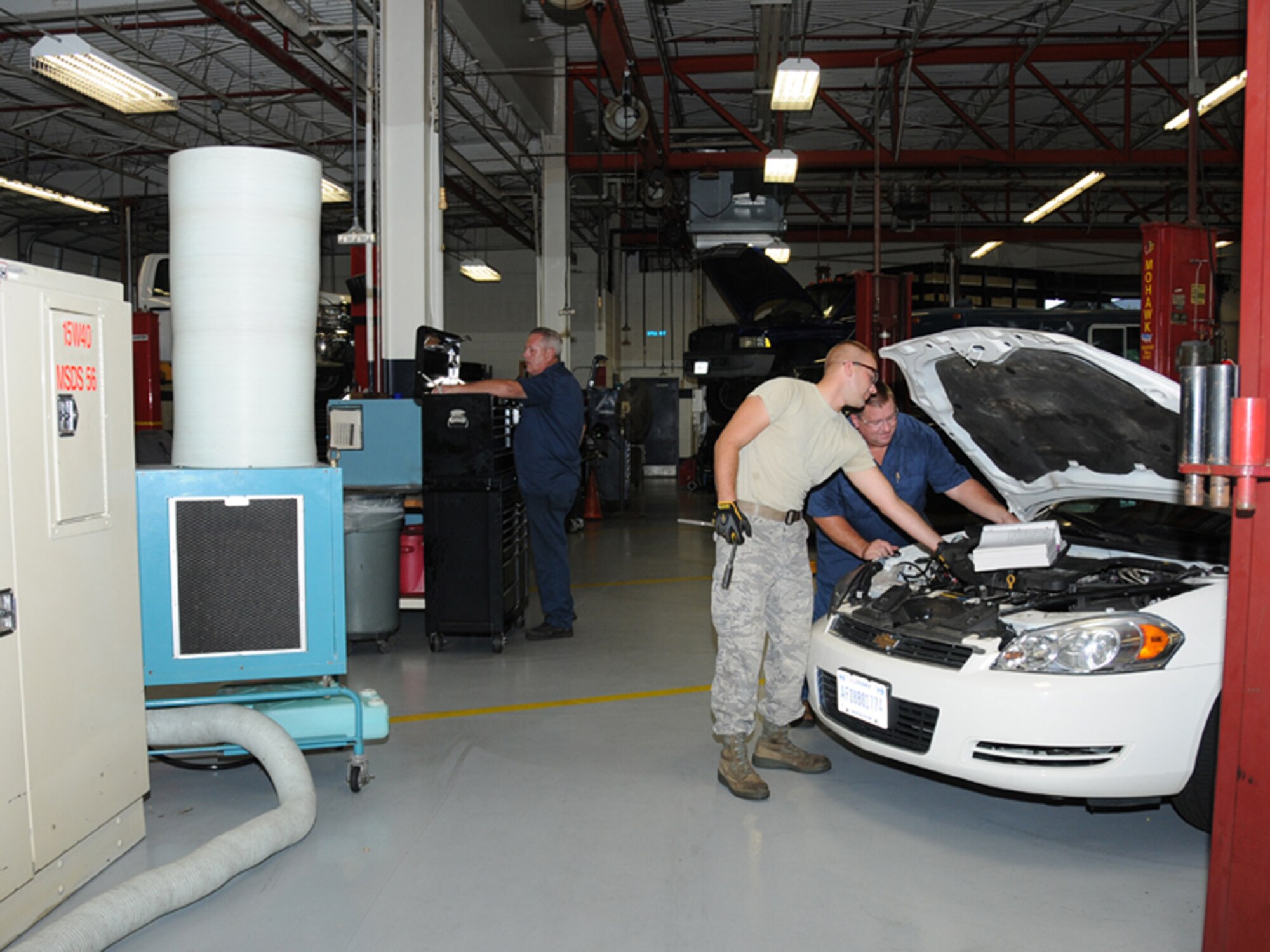 From left, Steven Cain, Airman 1st Class Matthew Chesnavage and Michael Rhodes, 81st Logistics Readiness Squadron, work in Keesler’s vehicle maintenance section.
In addition to the squadron, other areas assessed are the supply, fuels, munitions and transient alert sections and performance management office. Outstanding performers
recognized by the LCAP team from the 81st LRS are Staff Sgt. Derrick Gerlich, Senior Airman Patsy Chandler, William Harrison, Miles Burton, Donald Gavin Jr., and
Bobby Rakes.  (U.S. Air Force photo by Kemberly Groue)