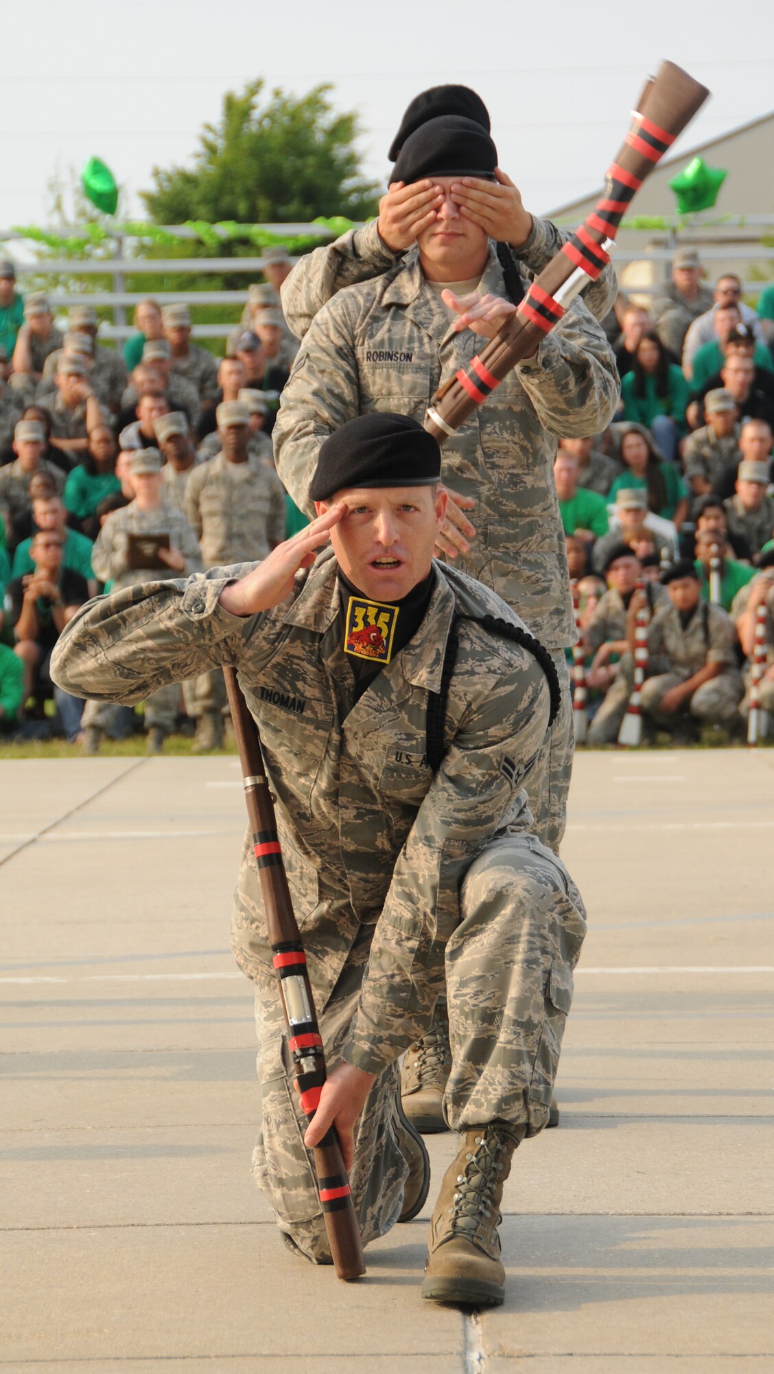 From front, Airman 1st Class Jacob Thoman, drillmaster; Airman 1st Class Robert Robinson and Airman Steven Daniels show how the 335th TRS won first place in the freestyle competition.  (U.S. Air Force photo by Kemberly Groue)