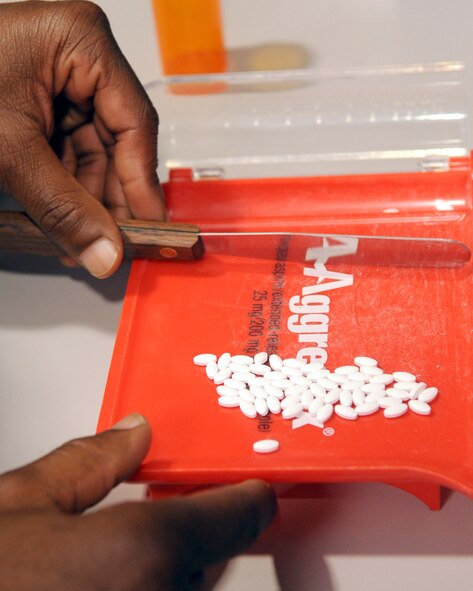 Staff Sgt. Bobby Banks, 2nd Medical Support Squadron main pharmacy NCOIC, verifies a pill count as he fills a prescription for a patient at the main base pharmacy on Barksdale Air Force Base, La., April 20. The Barksdale pharmacy provides medication for active duty, retirees, reservists on active orders and their dependents. For prescription refills please call the satellite pharmacy at 456-8348. (U.S. Air Force photo/Senior Airman La?Shanette V. Garrett) (RELEASED)