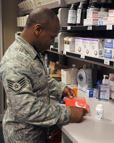 Staff Sgt. Bobby Banks, 2nd Medical Support Squadron main pharmacy NCOIC, fills a prescription for a patient at the base pharmacy on Barksdale Air Force Base, La., April 20. The Barksdale pharmacy provides medication for active duty, retirees, reservists on active orders and their dependents. For prescription refills please call the satellite pharmacy at 456-8348. The satellite pharmacy operates from 8:30 a.m. until 6:00 p.m., but closes at noon the second Thursday of each month for training. (U.S. Air Force photo/Senior Airman La?Shanette V. Garrett) (RELEASED)